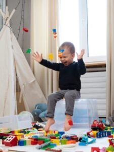 full-shot-happy-kid-sitting-container_23-2149311328
