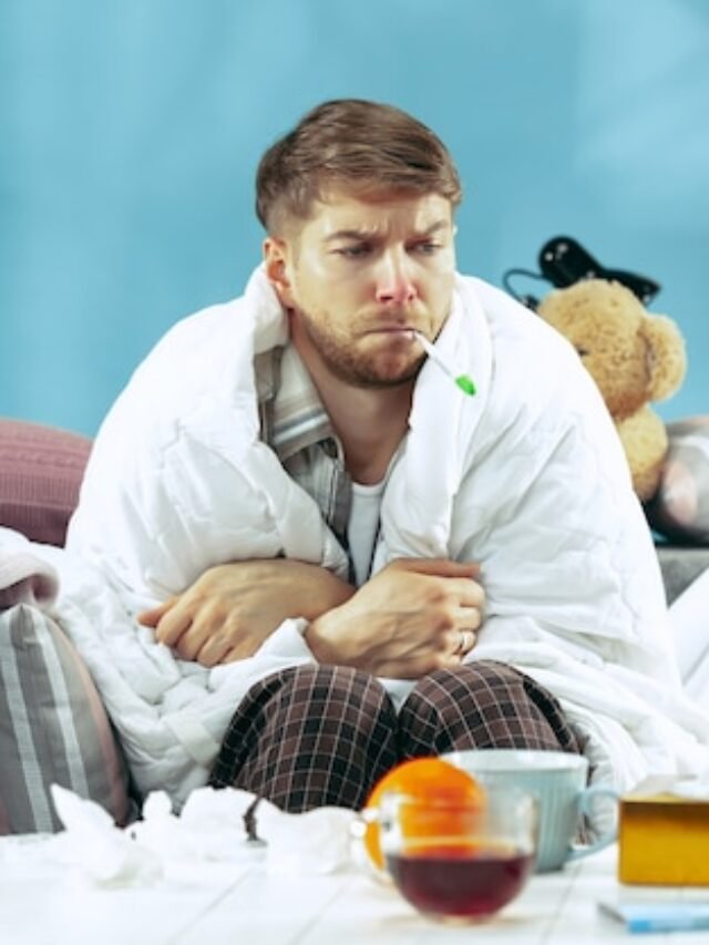 bearded-sick-man-with-flue-sitting-sofa-home-measuring-body-temperature-winter-illness-influenza-pain-concept-relaxation-home-healthcare-concepts_155003-31685