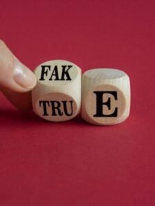 fake-true-symbol-businessman-flips-wooden-cube-changes-word-fake-true-vice-versa_606207-569