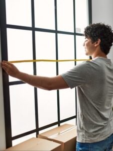 stock-photo-young-hispanic-man-smiling-happy-moving-at-new-home-2033983340-transformed